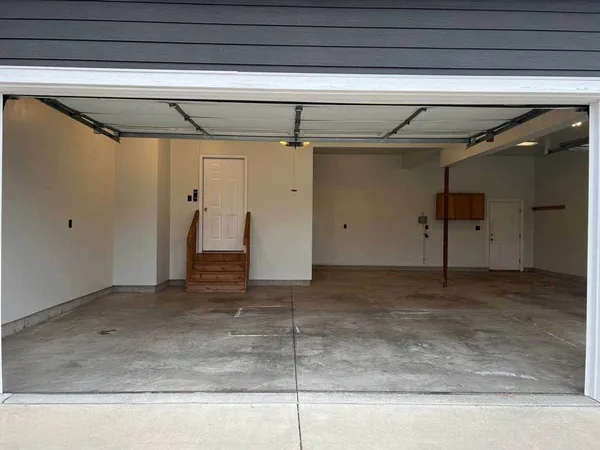 Worn concrete garage floor before polyurea coating